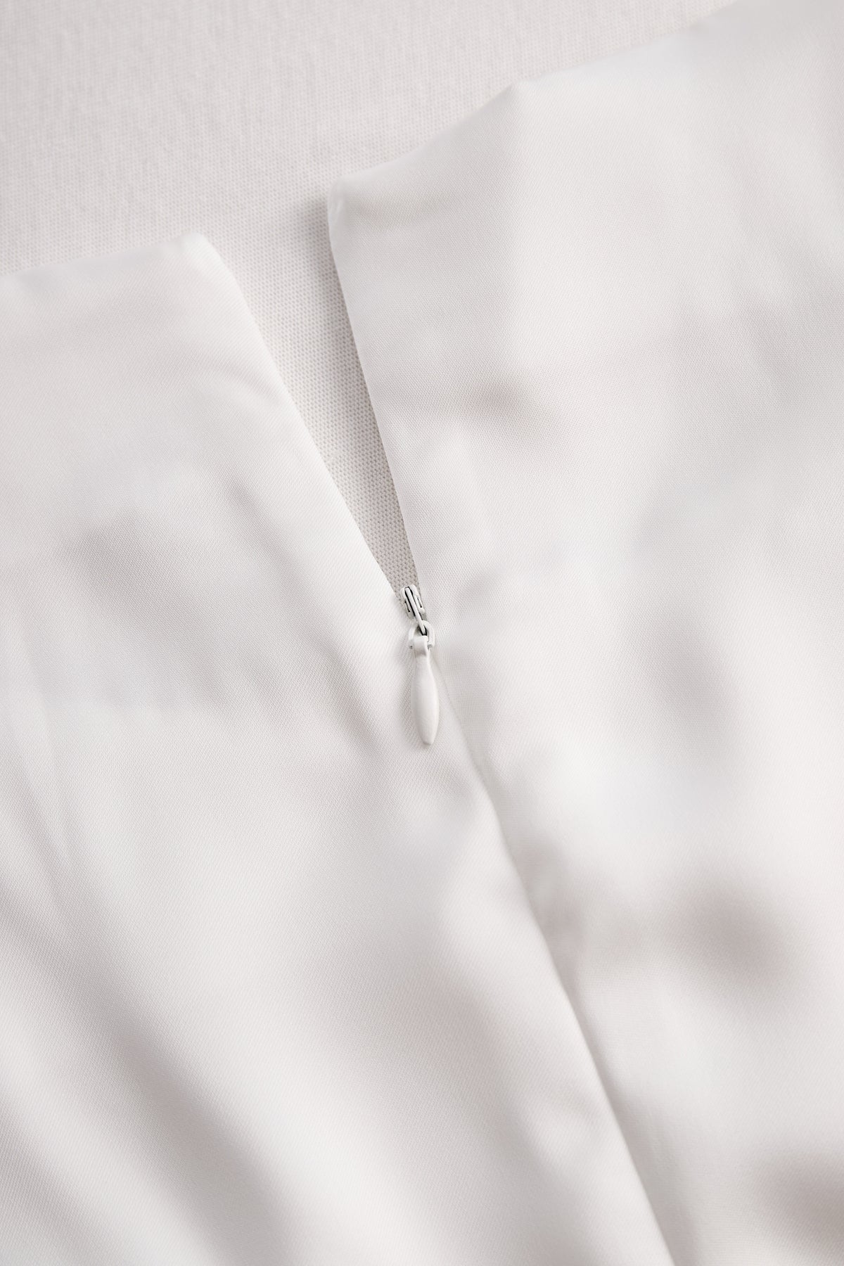 Elegant White Draped Top with Button Detail